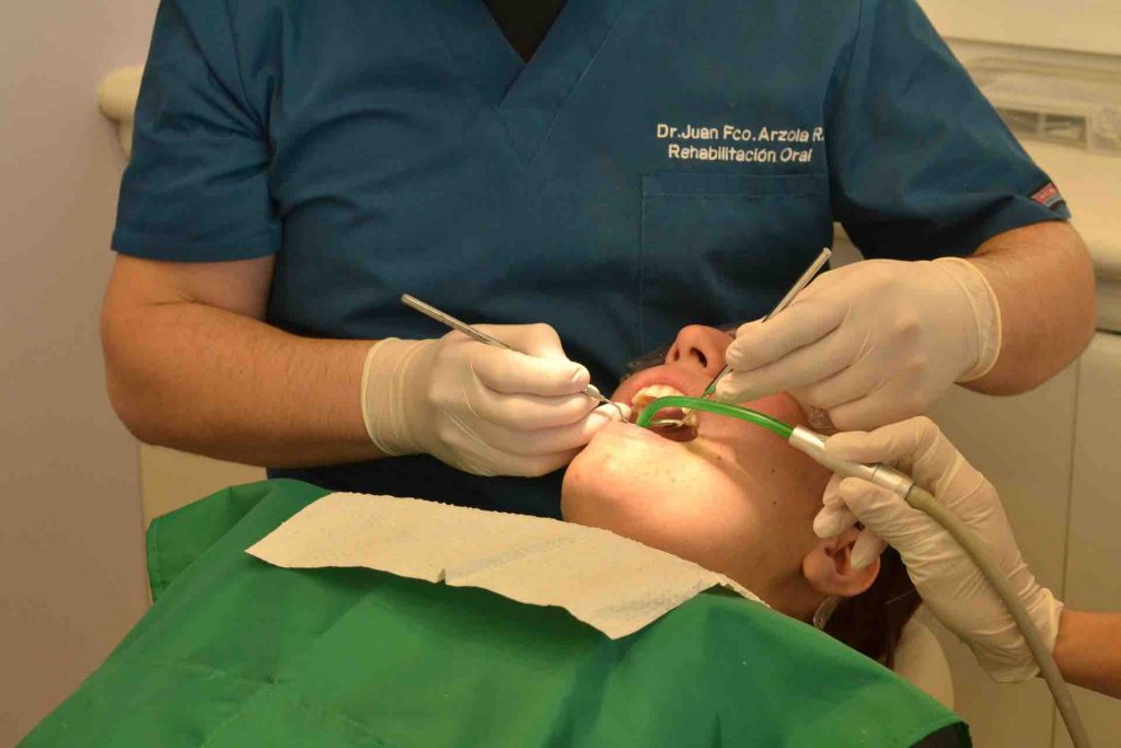 Man getting dental implants installed
