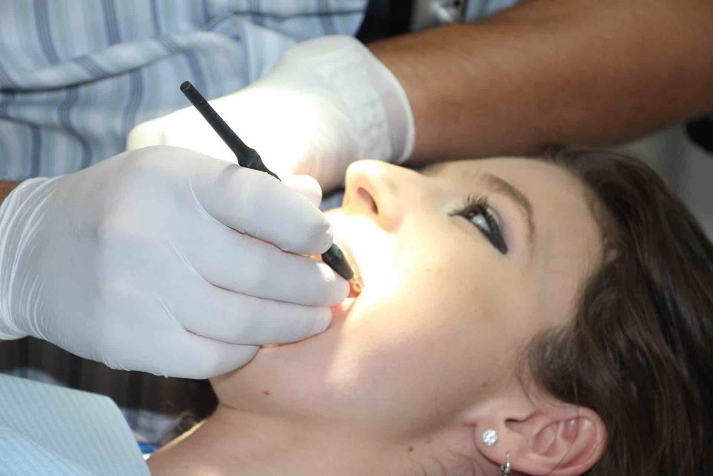 Dentist working on a female patient